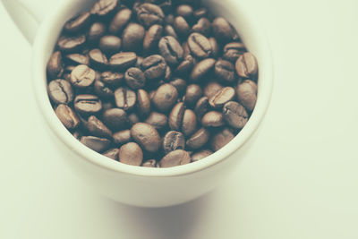 High angle view of coffee beans in bowl