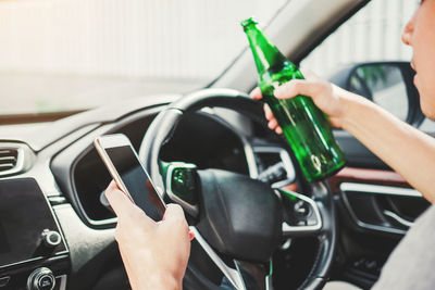Midsection of man driving car