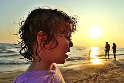 Portrait of women on beach during sunset