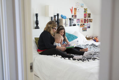 Mother reading with kids