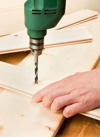 Close-up of hands working on table