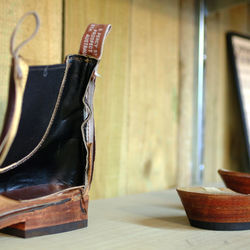 Close-up of shoe on wooden table