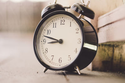 Close-up of clock on table