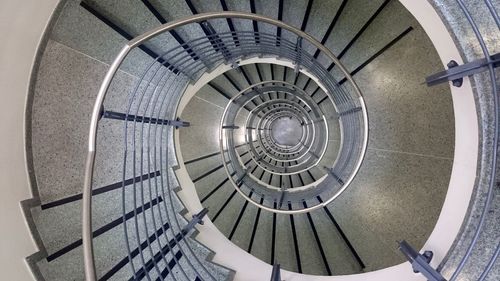 Directly above view of spiral staircase in building