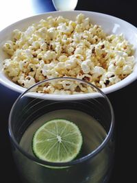 Close-up of popcorn and lemon juice