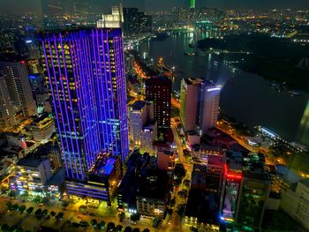 High angle view of illuminated buildings in city at night