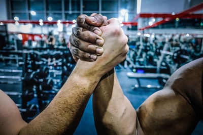 Close-up of man with hand holding water