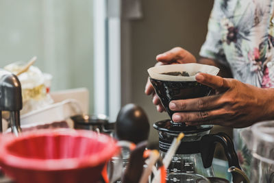 Midsection of man preparing food