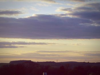 Scenic view of landscape against cloudy sky