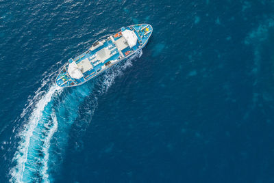 High angle view of boat sailing in sea