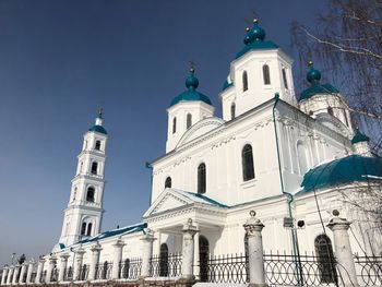 Low angle view of church against blue sky