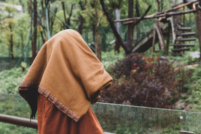 Rear view of man standing outdoors