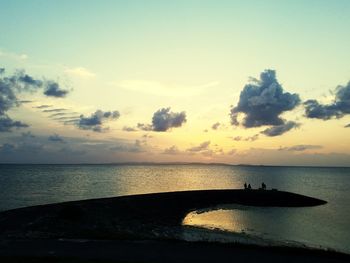 Scenic view of sea against sky at sunset