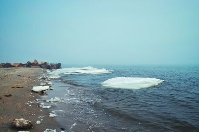 Scenic view of sea against clear blue sky