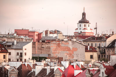 Buildings in city against sky