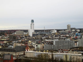 High angle view of buildings in city against sky