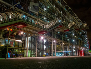 Low angle view of illuminated buildings at night