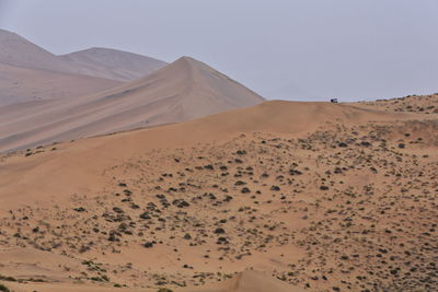 1030 moving and stationary sand dunes-badain jaran desert -tire tracks on the sand. nei mongol-china