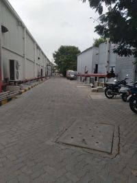 Street amidst buildings in city against sky