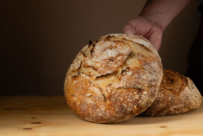 Cropped hand of person holding bread