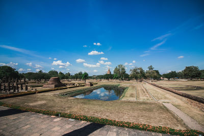 Scenic view of landscape against blue sky