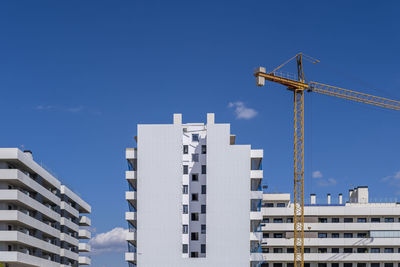 Construction cranes in apartment buildings in barcelona