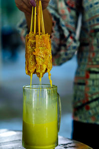 Close-up of woman holding drink