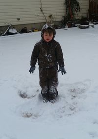 Boy playing in snow