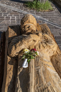 High angle view of buddha statue by potted plant