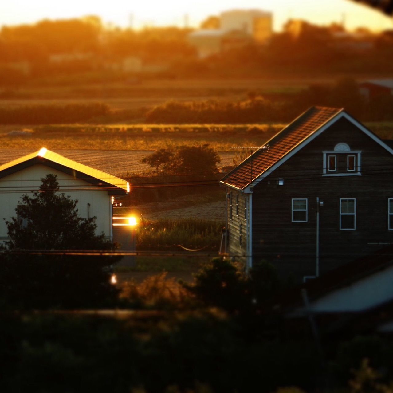 HOUSE AGAINST SKY AT SUNSET