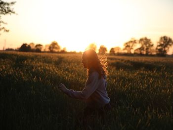 Side view of a woman in field