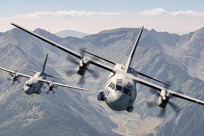 Military airplanes flying over mountains