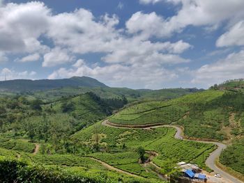 Scenic view of agricultural landscape against sky