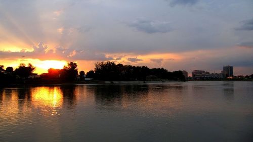 Scenic view of lake at sunset