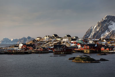 Scenic view of sea and buildings against sky