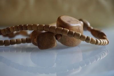 Close-up of necklace on table