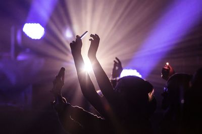 People enjoying music concert