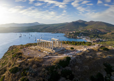 High angle view of townscape by sea against sky