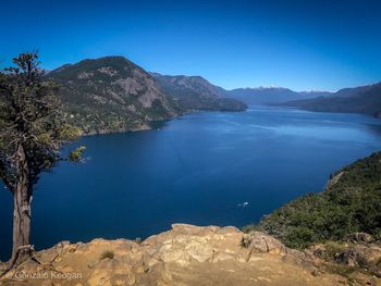 Scenic view of sea against clear blue sky