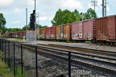 Train on railroad tracks against sky