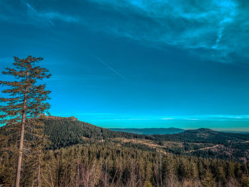 Low angle view of mountain against blue sky