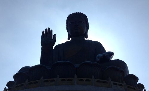 Low angle view of statue against sky