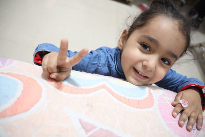 Portrait of cute girl smiling at home