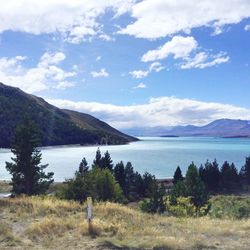 Scenic shot of calm lake against mountain range