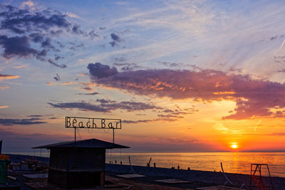 Scenic view of beach against sky during sunset