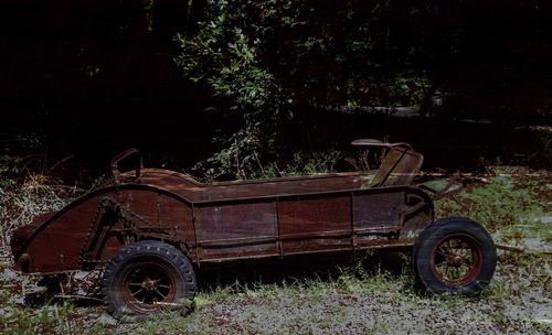 Abandoned vehicle on field