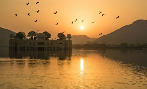 Idyllic view of jal mahal during sunset against sky