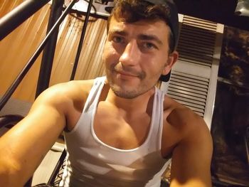 Portrait of young man sitting outdoors