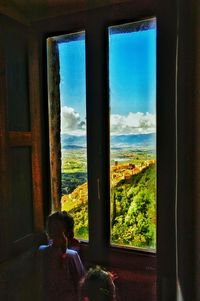 View of sea through window