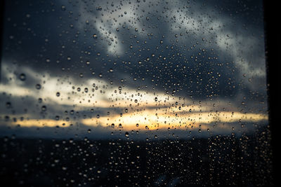 Full frame shot of raindrops on glass window